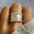 Titanium ring encircled with two diamond bands